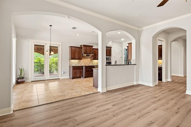 462 Shelf Rock, Driftwood, TX 78619 - unfurnished living room with light wood-style flooring, a ceiling fan, baseboards, ornamental molding, and a sink
