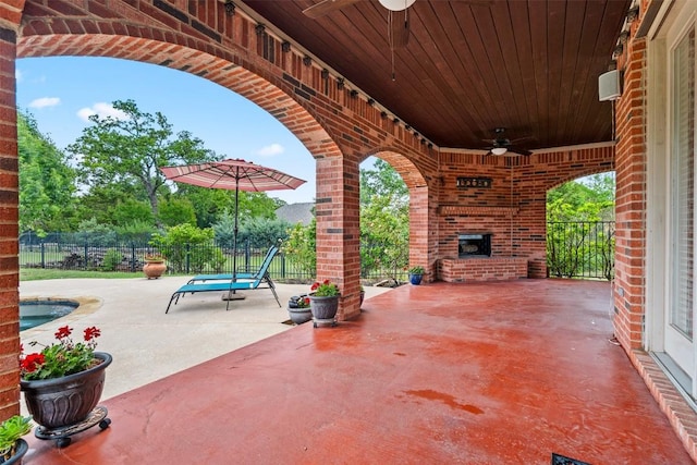 462 Shelf Rock, Driftwood, TX 78619 - view of patio / terrace with ceiling fan and an outdoor brick fireplace