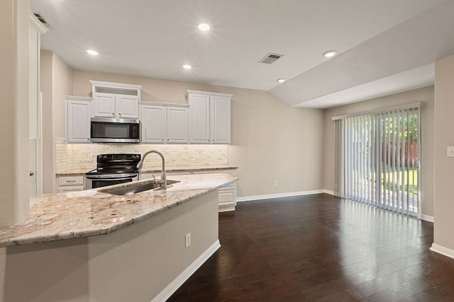 425 Valley Oaks Loop, Georgetown, TX 78626 - kitchen featuring appliances with stainless steel finishes, a sink, dark wood finished floors, backsplash, and white cabinetry