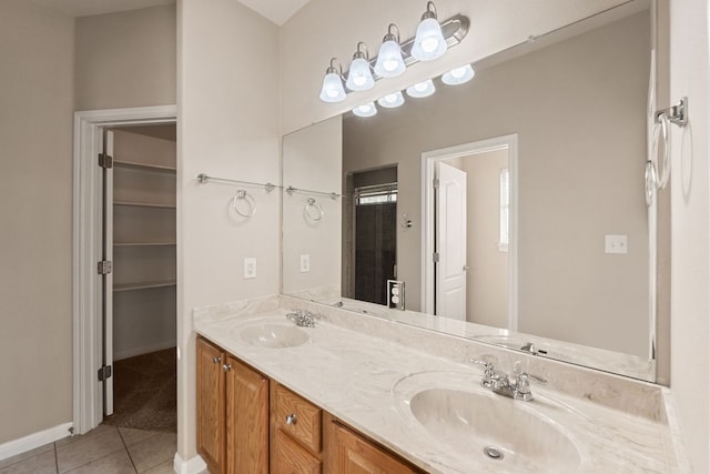 425 Valley Oaks Loop, Georgetown, TX 78626 - full bath with tile patterned floors, double vanity, and baseboards