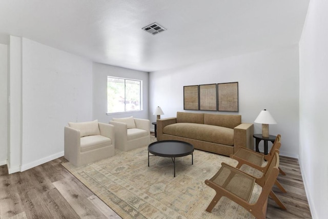 5912 Wagon Bnd, Austin, TX 78744 - living area featuring wood finished floors and baseboards