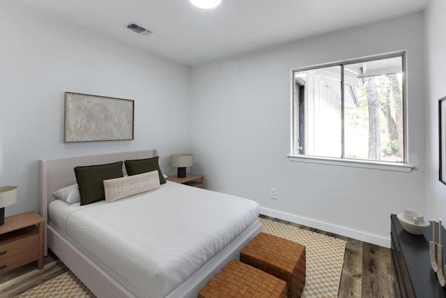 5912 Wagon Bnd, Austin, TX 78744 - bedroom with wood finished floors and baseboards
