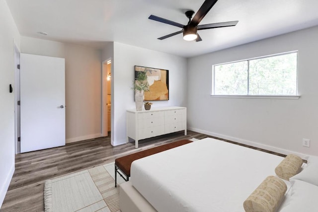 5912 Wagon Bnd, Austin, TX 78744 - bedroom with wood finished floors and ceiling fan
