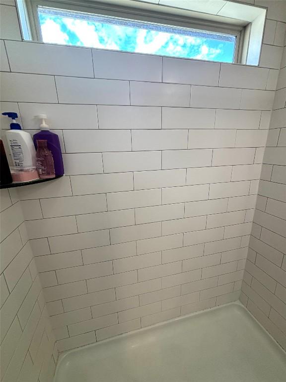 bathroom featuring a shower