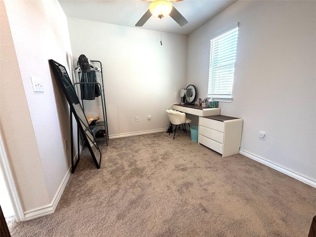 office area featuring carpet flooring, ceiling fan, and baseboards