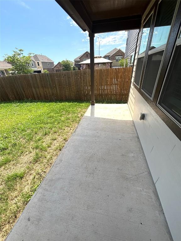 view of patio / terrace featuring fence
