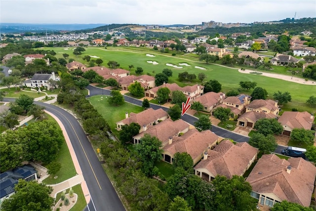 bird's eye view with view of golf course and a residential view