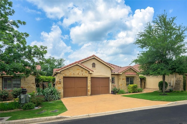 mediterranean / spanish-style home featuring an attached garage, stone siding, stucco siding, concrete driveway, and a tiled roof