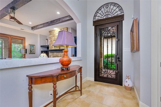 tiled entrance foyer with baseboards, recessed lighting, and visible vents