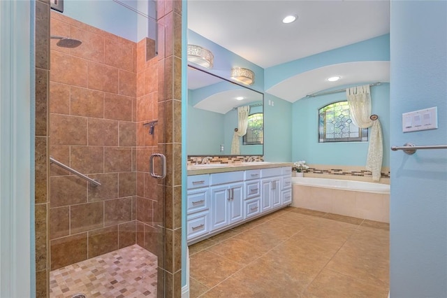 22 Borello Dr, Austin, TX 78738 - full bath featuring vanity, a garden tub, a stall shower, recessed lighting, and tile patterned flooring