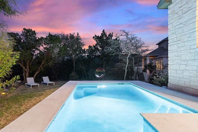 216 Vista Village Cv, Austin, TX 78738 - pool at dusk with a fenced backyard