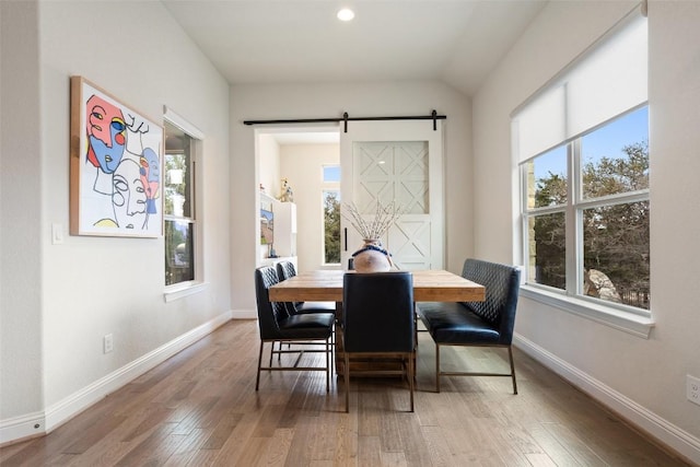 216 Vista Village Cv, Austin, TX 78738 - dining space featuring plenty of natural light, baseboards, light wood finished floors, and recessed lighting