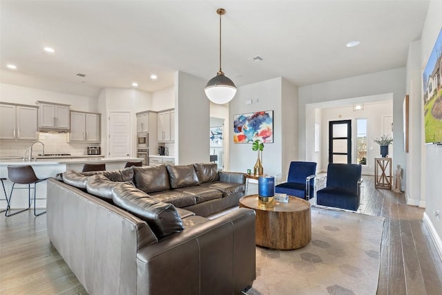 216 Vista Village Cv, Austin, TX 78738 - living area with light wood-style floors and recessed lighting