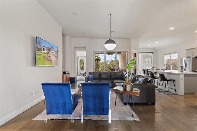 216 Vista Village Cv, Austin, TX 78738 - living area with wood finished floors, baseboards, and recessed lighting