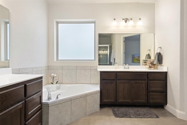 216 Vista Village Cv, Austin, TX 78738 - full bath with a shower stall, two vanities, a bath, and tile patterned flooring