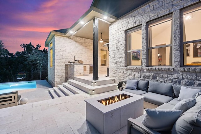 216 Vista Village Cv, Austin, TX 78738 - patio terrace at dusk featuring an outdoor living space with a fire pit, a patio, and an outdoor pool