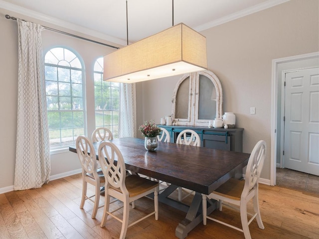 19200 White Horse Cv, Spicewood, TX 78669 - dining space with baseboards, ornamental molding, and light wood-type flooring