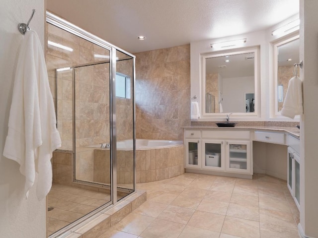 19200 White Horse Cv, Spicewood, TX 78669 - bathroom with vanity, a textured ceiling, recessed lighting, a shower stall, and a bath