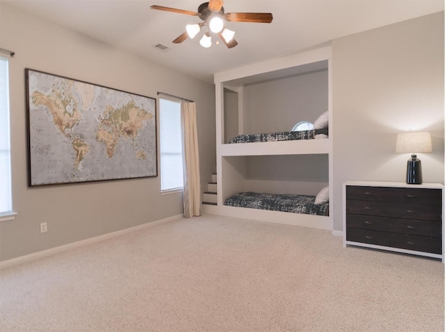 19200 White Horse Cv, Spicewood, TX 78669 - carpeted bedroom with visible vents, baseboards, and ceiling fan