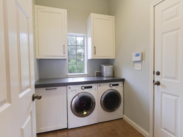19200 White Horse Cv, Spicewood, TX 78669 - washroom featuring baseboards, cabinet space, washing machine and dryer, and dark tile patterned flooring