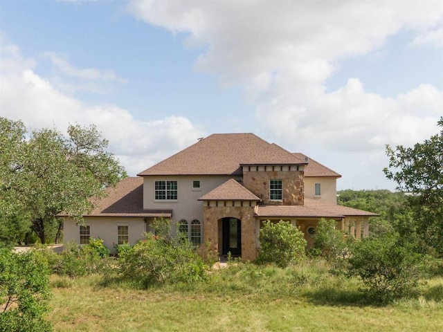 19200 White Horse Cv, Spicewood, TX 78669 - view of front of home with a shingled roof and stucco siding