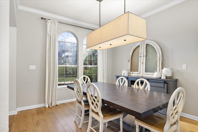19200 White Horse Cv, Spicewood, TX 78669 - dining area featuring light wood-type flooring, ornamental molding, and healthy amount of natural light