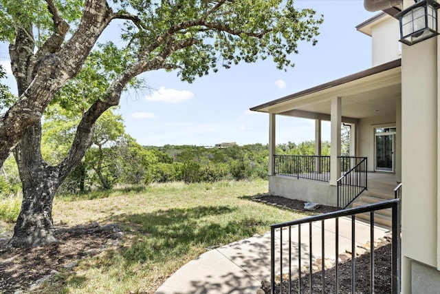 19200 White Horse Cv, Spicewood, TX 78669 - view of grassy yard featuring a porch