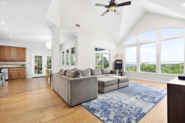 19200 White Horse Cv, Spicewood, TX 78669 - living area featuring plenty of natural light, a ceiling fan, recessed lighting, light wood-type flooring, and high vaulted ceiling