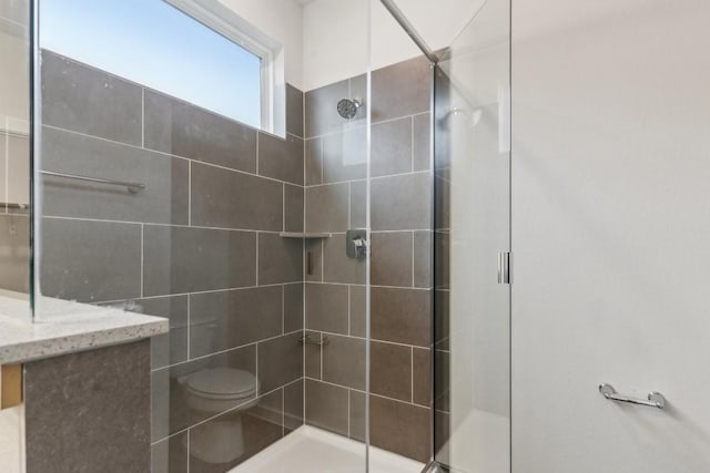 full bathroom with toilet and a stall shower