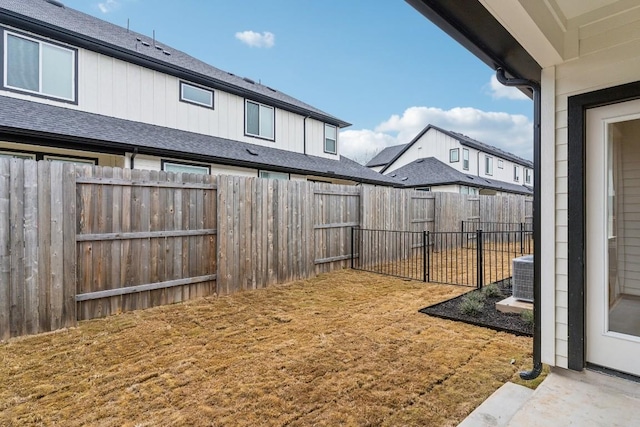 view of yard featuring a fenced backyard and cooling unit