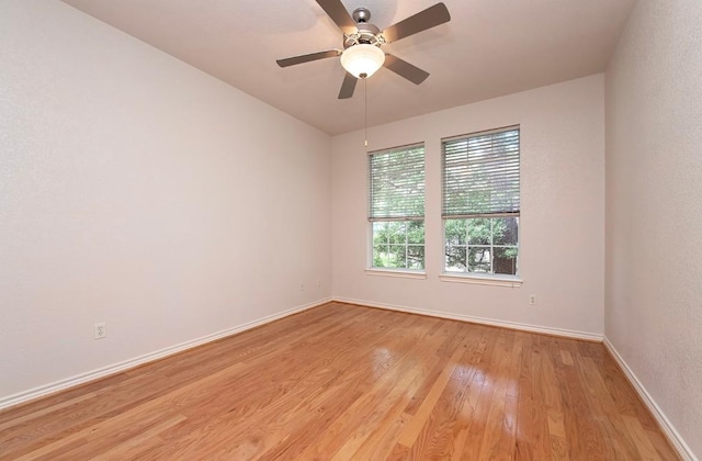 411 Brazos Dr, Georgetown, TX 78628 - empty room with light wood-type flooring, baseboards, and a ceiling fan