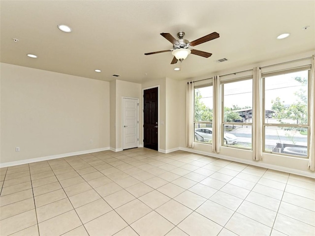 unfurnished room with ceiling fan, visible vents, baseboards, recessed lighting, and light tile patterned flooring