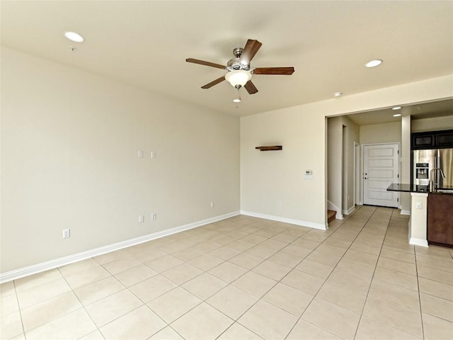 unfurnished room featuring recessed lighting, a ceiling fan, light tile patterned floors, and baseboards