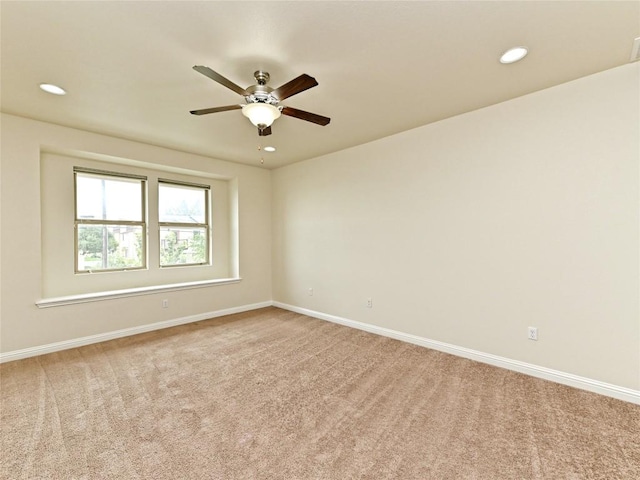 spare room featuring baseboards, recessed lighting, carpet, and ceiling fan