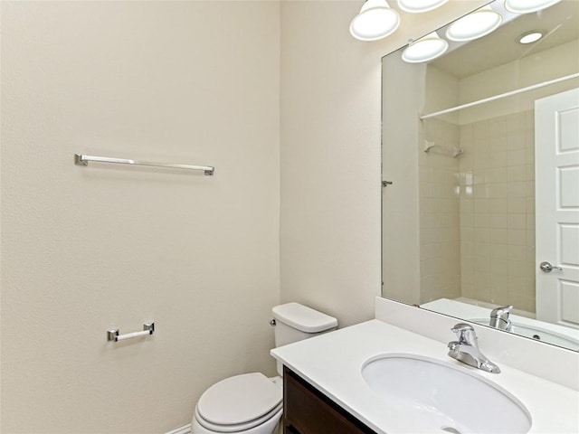 full bath featuring vanity, walk in shower, and toilet