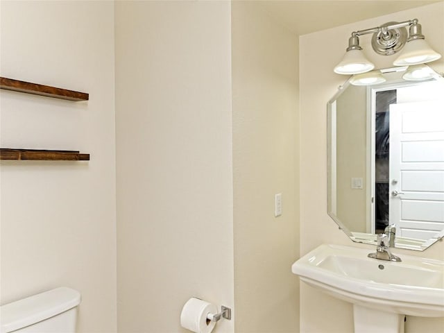 bathroom featuring a sink and toilet