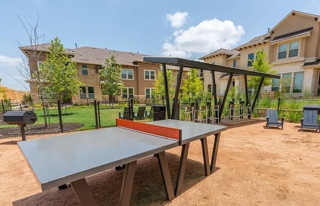 view of property's community featuring fence