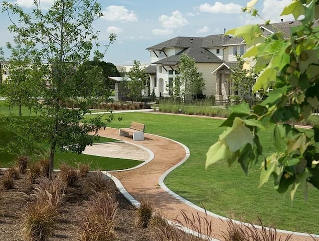 view of home's community featuring a lawn