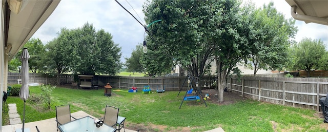 2305 Amen Corner Rd, Pflugerville, TX 78660 - view of yard featuring outdoor dining area, a fenced backyard, and a patio area