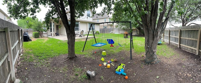 2305 Amen Corner Rd, Pflugerville, TX 78660 - view of yard with a fenced backyard, a playground, and a patio area