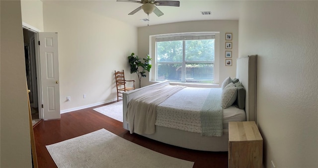 2305 Amen Corner Rd, Pflugerville, TX 78660 - bedroom with baseboards, a ceiling fan, wood finished floors, and visible vents