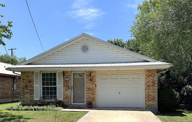 ranch-style home featuring an attached garage, driveway, and brick siding
