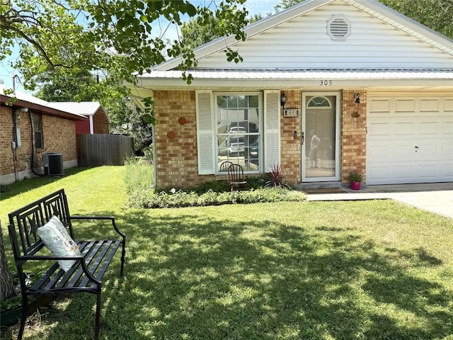 single story home featuring brick siding, central AC, fence, a front lawn, and an attached garage