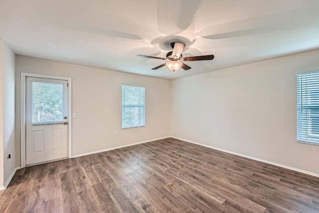 9504 Southwick Dr, Austin, TX 78724 - empty room featuring plenty of natural light, wood finished floors, and ceiling fan