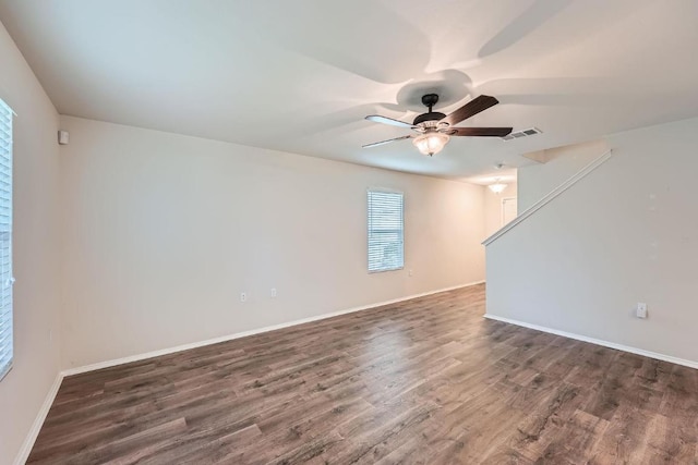 9504 Southwick Dr, Austin, TX 78724 - spare room with a ceiling fan, wood finished floors, and baseboards