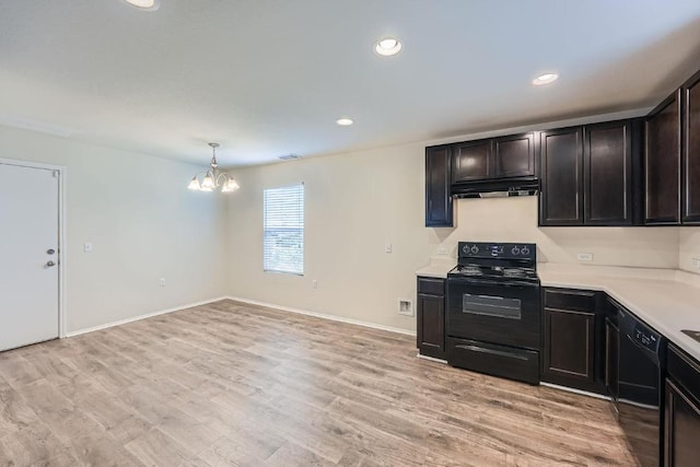 9504 Southwick Dr, Austin, TX 78724 - kitchen with black appliances, under cabinet range hood, a chandelier, light countertops, and light wood finished floors