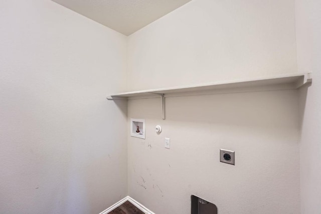 9504 Southwick Dr, Austin, TX 78724 - laundry area with electric dryer hookup, washer hookup, baseboards, hookup for a gas dryer, and wood finished floors