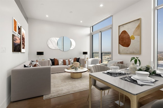 living area with recessed lighting and wood finished floors