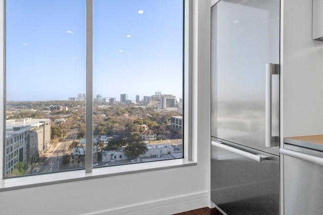 room details with a city view and stainless steel refrigerator