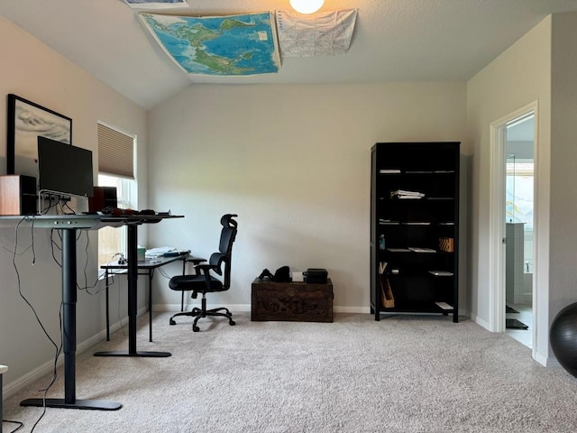 office with vaulted ceiling, baseboards, carpet flooring, and a wealth of natural light